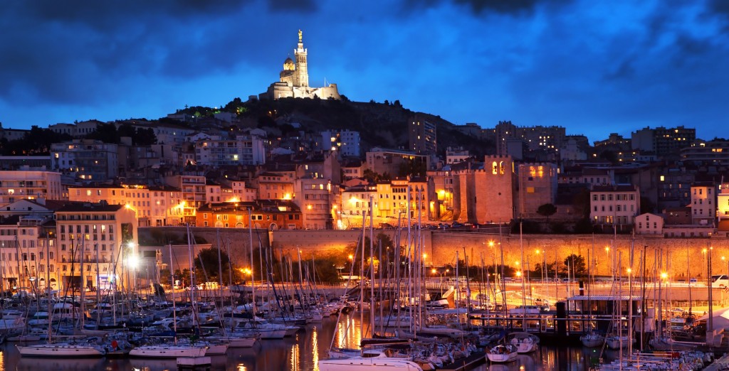 Marseille, France panorama at night. The famous european harbour view on the Notre Dame de la Garde